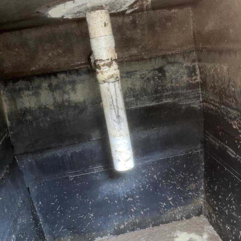 Septic tank interior with vent pipe and water level Septic tank interior with vent pipe and water level