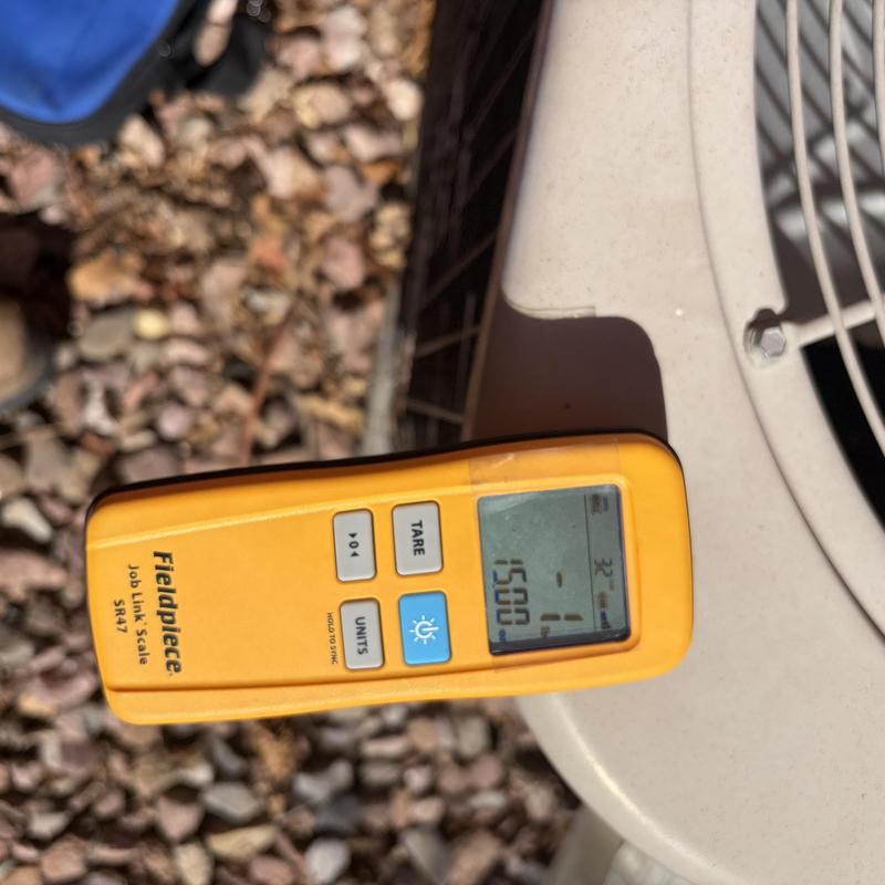 Refrigerant charging scale on outdoor AC unit Refrigerant charging scale on outdoor AC unit