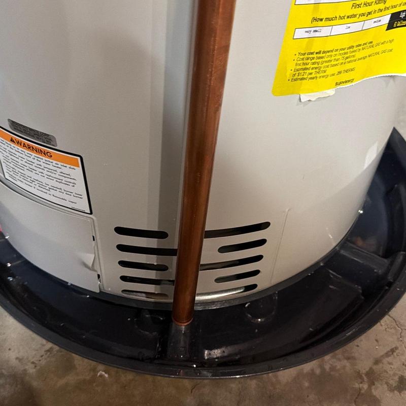Water heater base and drain pipe installation detail Water heater base and drain pipe installation detail
