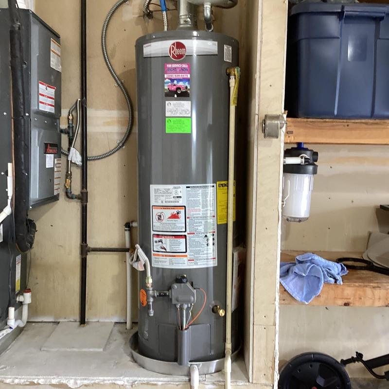 Whole home Culligan filter housing installation next to water heater Whole home Culligan filter housing installation next to water heater