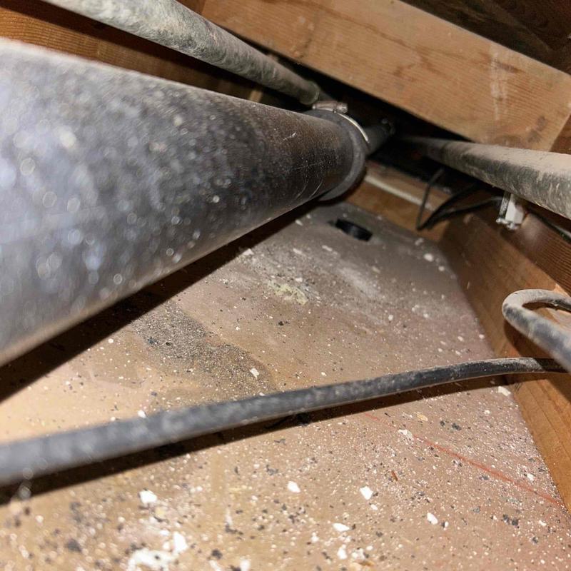 Tub waste and overflow pipe in basement ceiling cavity Tub waste and overflow pipe in basement ceiling cavity