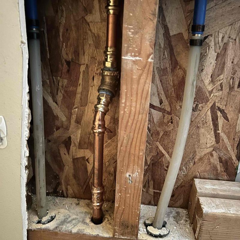 Copper shower valve plumbing behind drywall panel removed Copper shower valve plumbing behind drywall panel removed