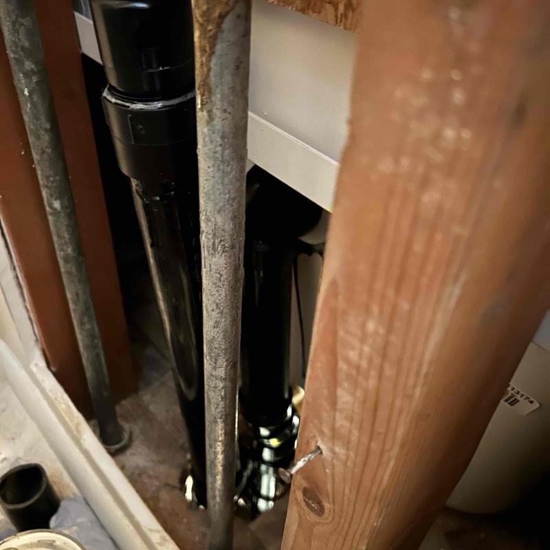 Tub drain waste pipe behind opened drywall framing Tub drain waste pipe behind opened drywall framing
