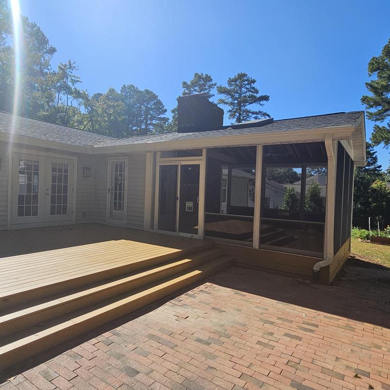Screened porch with adjacent deck and brick patio Screened porch with adjacent deck and brick patio