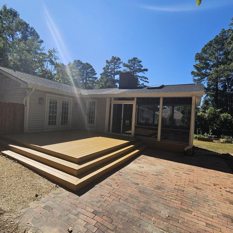 Wooden deck with steps and screened porch addition Wooden deck with steps and screened porch addition