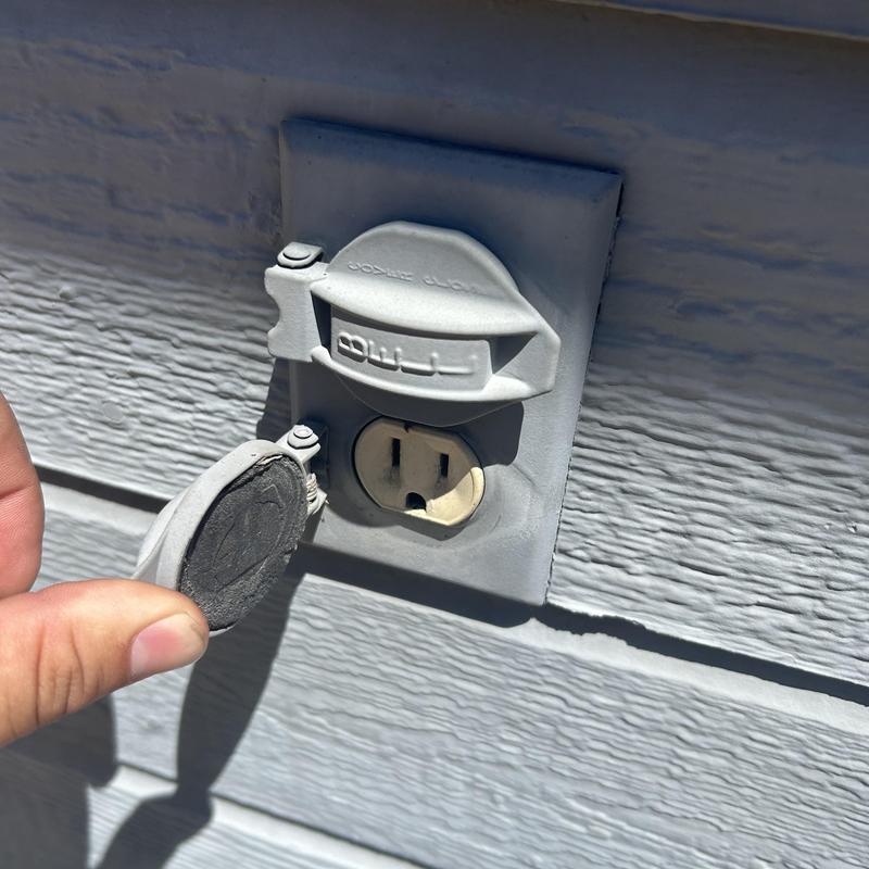 Exterior electrical receptacle with damaged weather cover