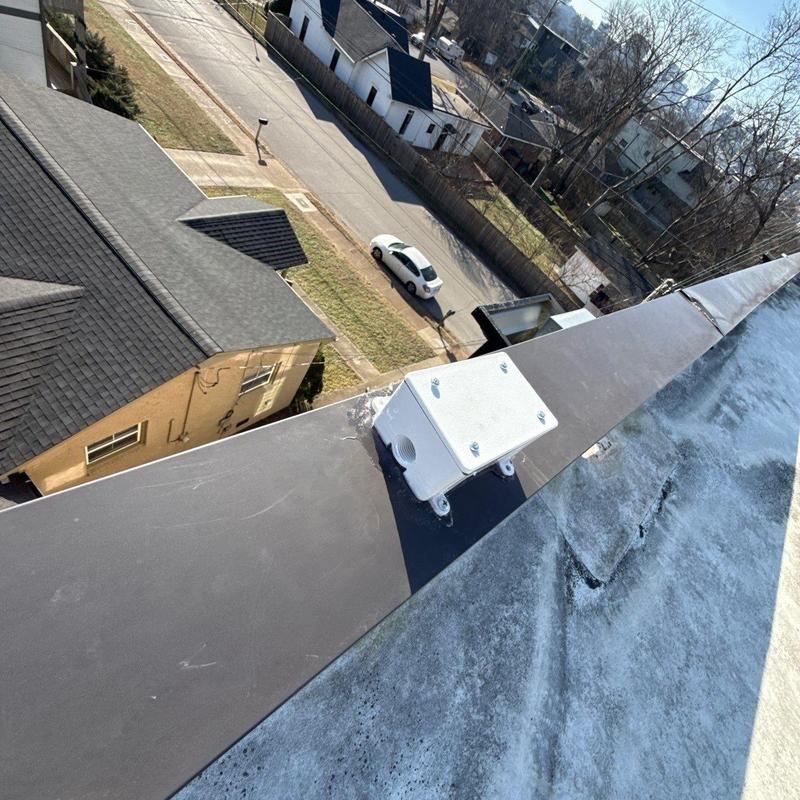 Roof flashing with metal base and mounting box on roof edge