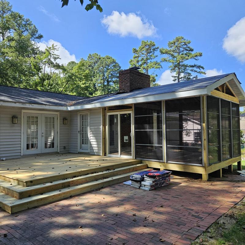 Screened porch addition with new wood deck Screened porch addition with new wood deck