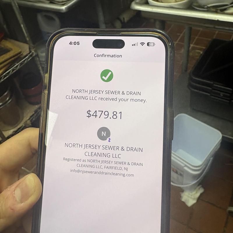 Kitchen floor drain payment confirmation on phone screen Kitchen floor drain payment confirmation on phone screen