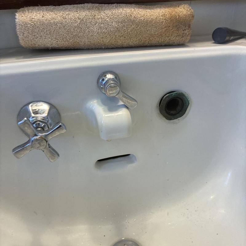 Bathroom sink faucet with cold side washer removed
