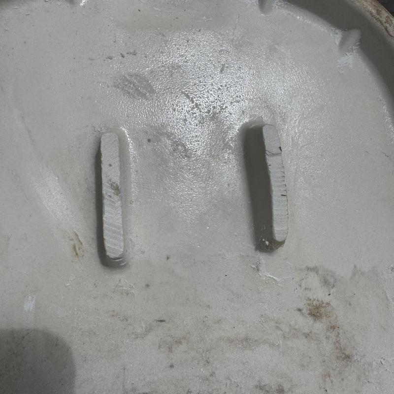 Toilet flange close-up showing fast-drying concrete repair