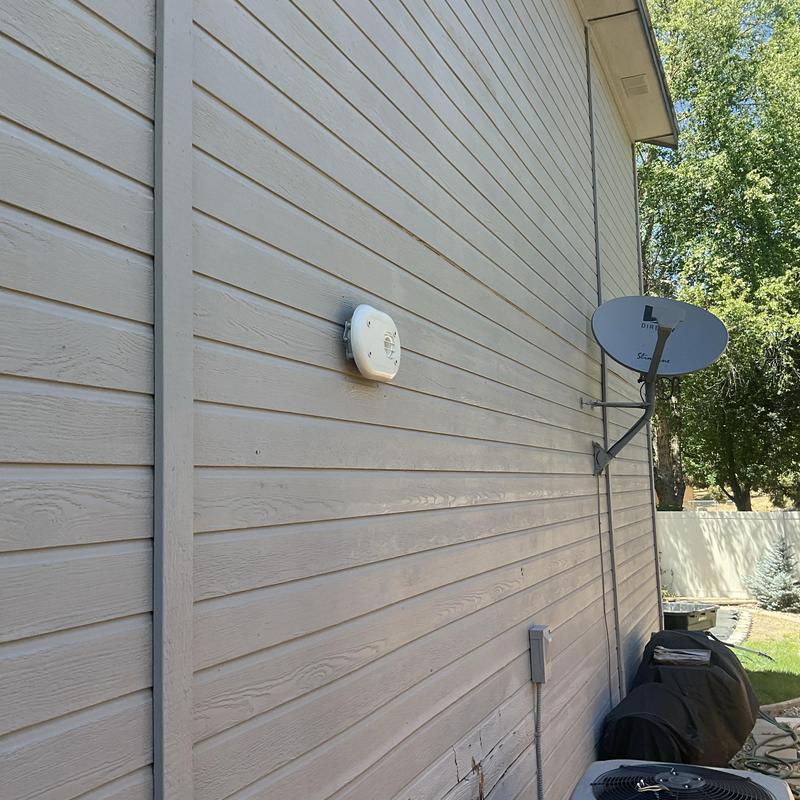Tankless water heater vent installed on house exterior Tankless water heater vent installed on house exterior