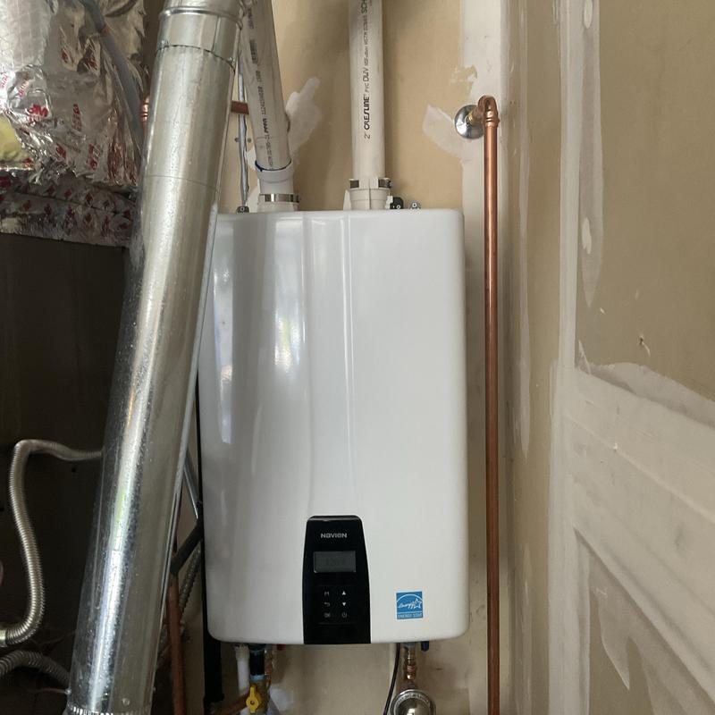 Tankless water heater with vent and piping installation Tankless water heater with vent and piping installation