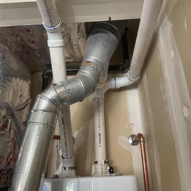 Tankless water heater vent and piping installation Tankless water heater vent and piping installation