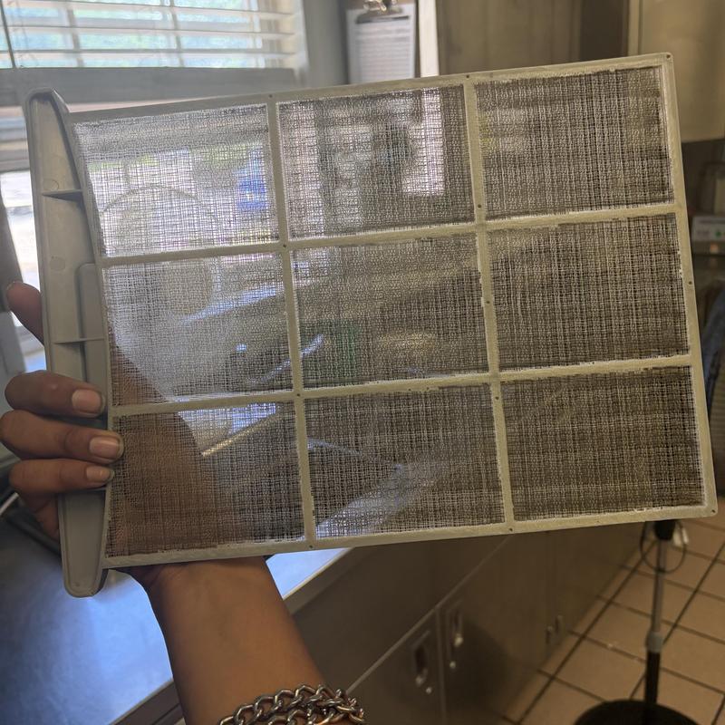 Ice machine air filter held for cleaning in kitchen Ice machine air filter held for cleaning in kitchen