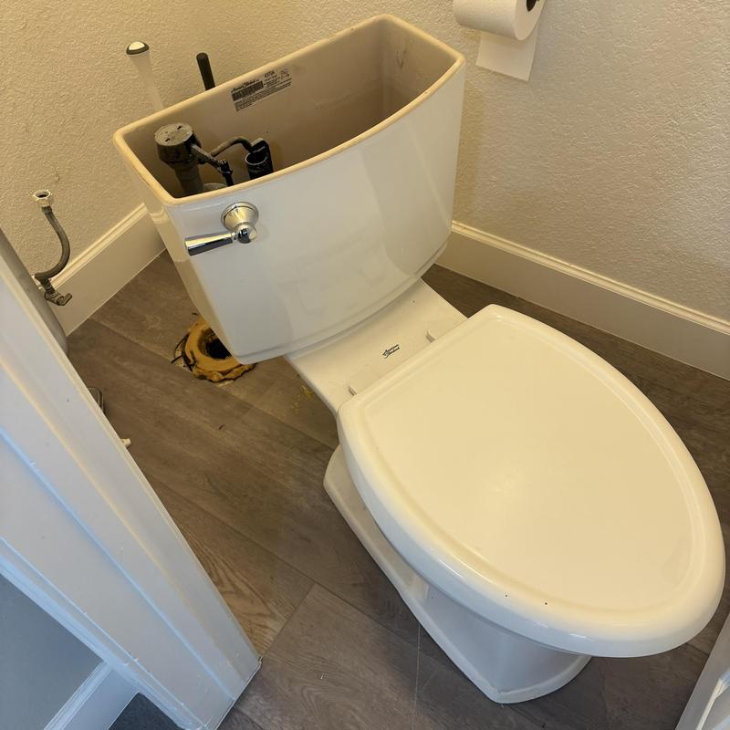 Toilet tank removed for auger and reset job