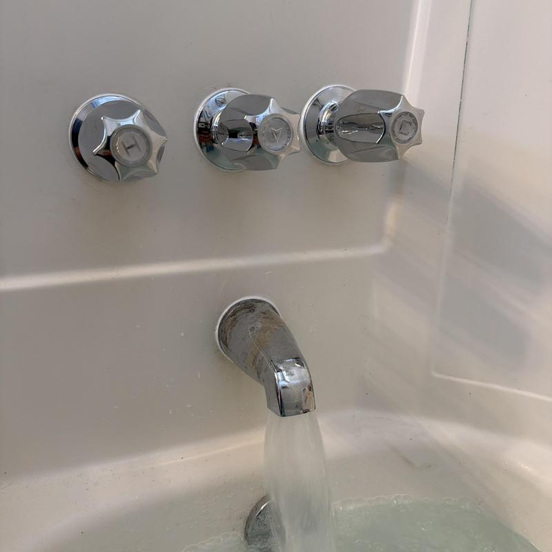 Tub shower handles and spout with running water Tub shower handles and spout with running water