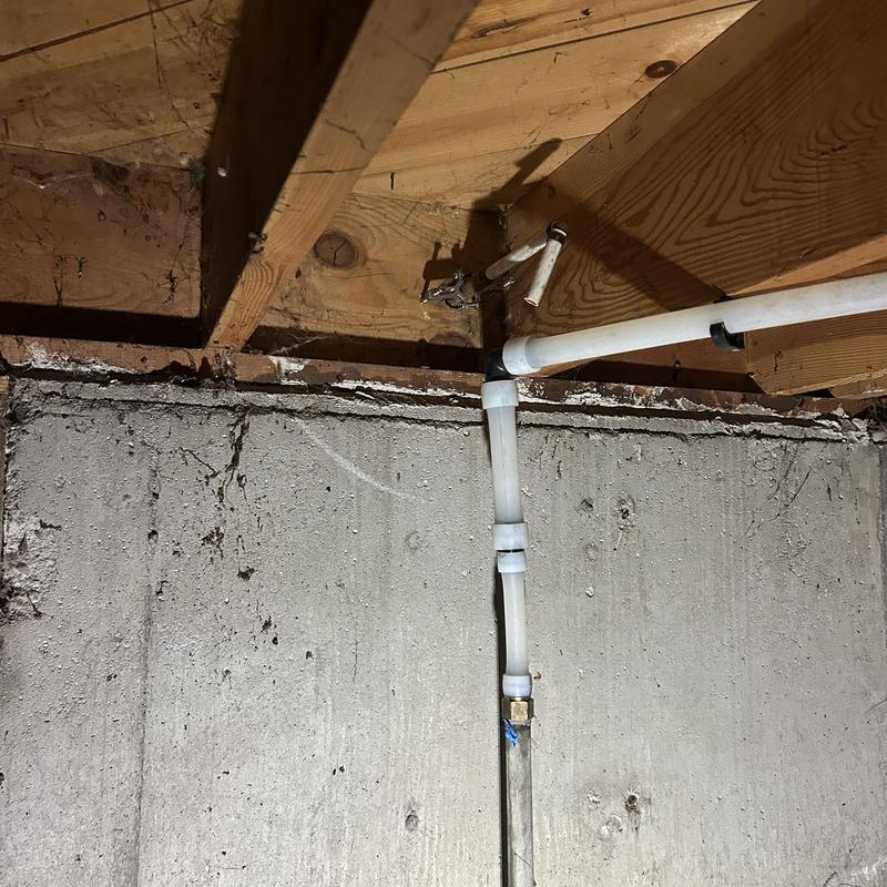 PVC waterline hooked up to basement hose bib