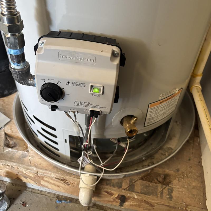 Water heater control panel with wiring and piping