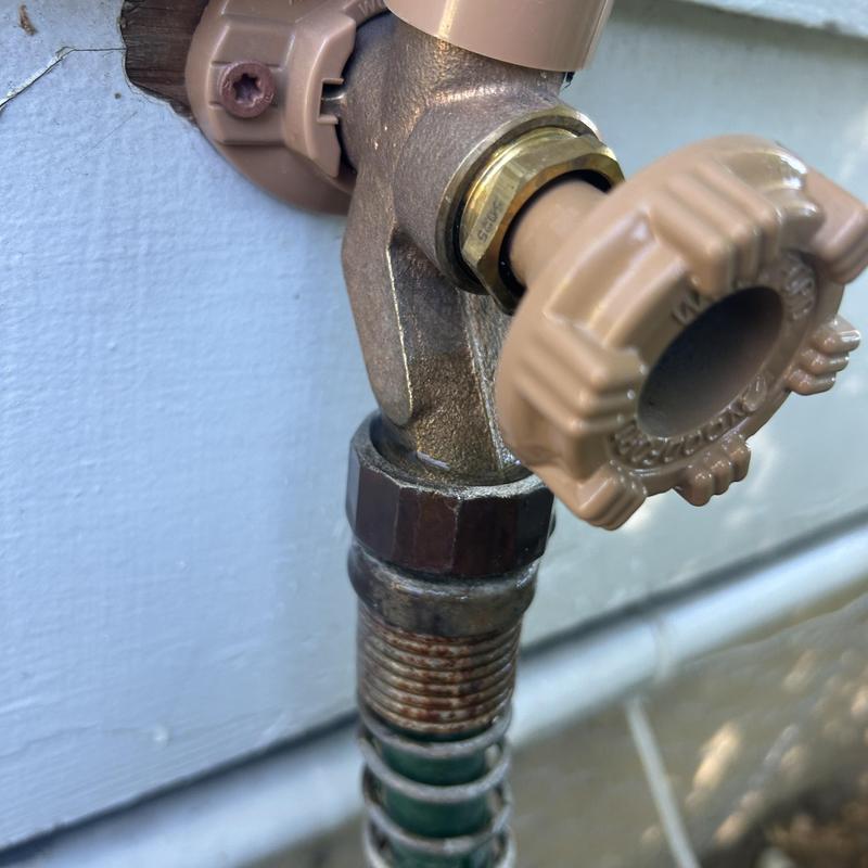 Outdoor water spigot with hose bibb vacuum breaker installation