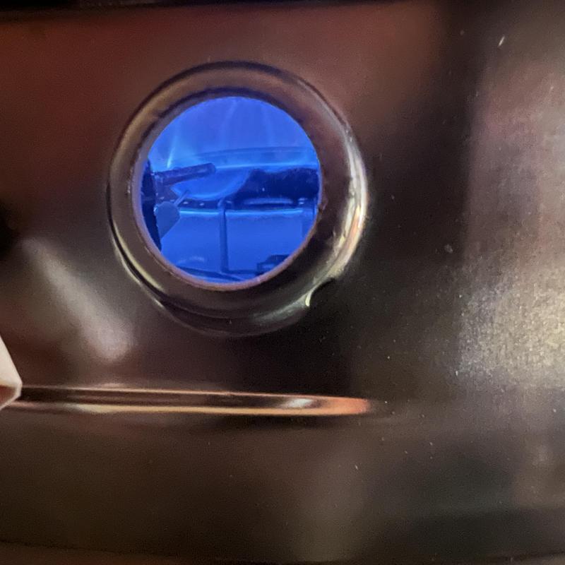 Gas water heater burner flame through viewing port