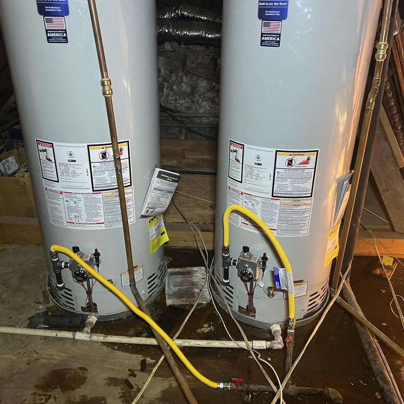 Gas water heaters with yellow gas lines in attic