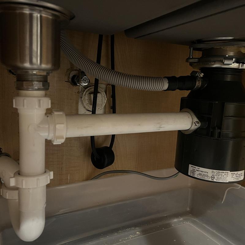 Kitchen sink plumbing and garbage disposal hookup undercounter