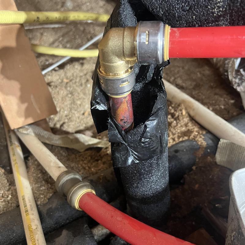 PEX water line with brass elbow and insulation repair