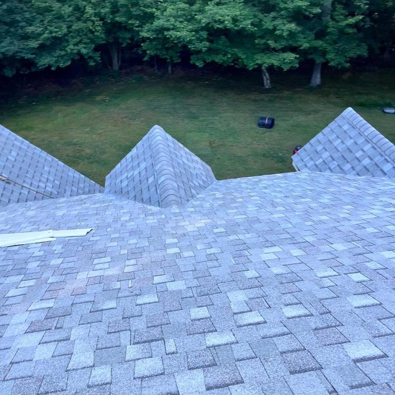 New asphalt shingle roof with multiple ridges New asphalt shingle roof with multiple ridges