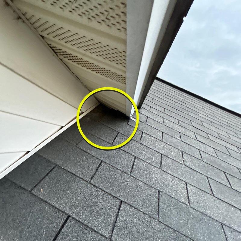 Roof shingles and flashing hail damage inspection close-up