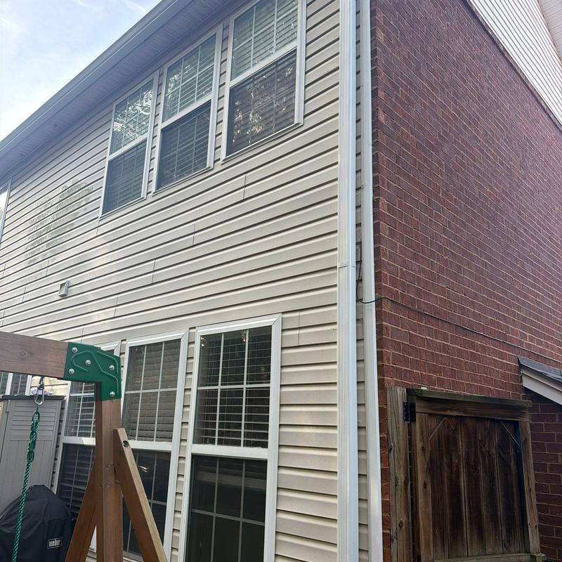 Vinyl siding and gutter system on house exterior