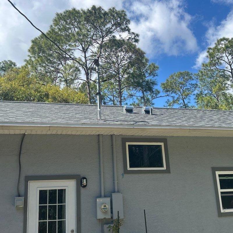 Shingle roof with vent pipes and electrical panel outside Shingle roof with vent pipes and electrical panel outside