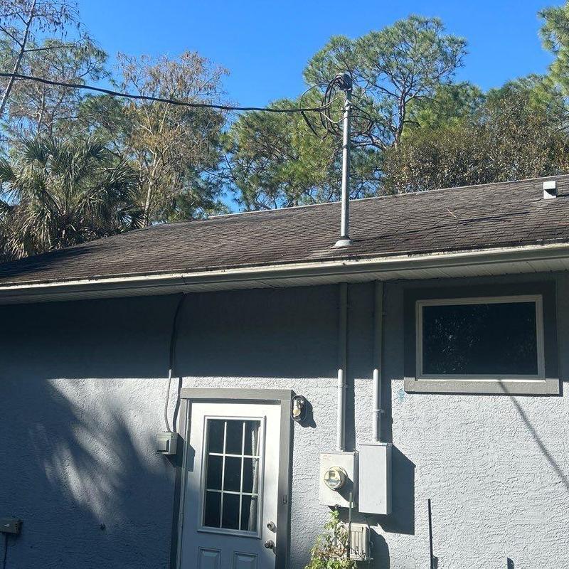 Electric meter and conduit installation on stucco wall Electric meter and conduit installation on stucco wall