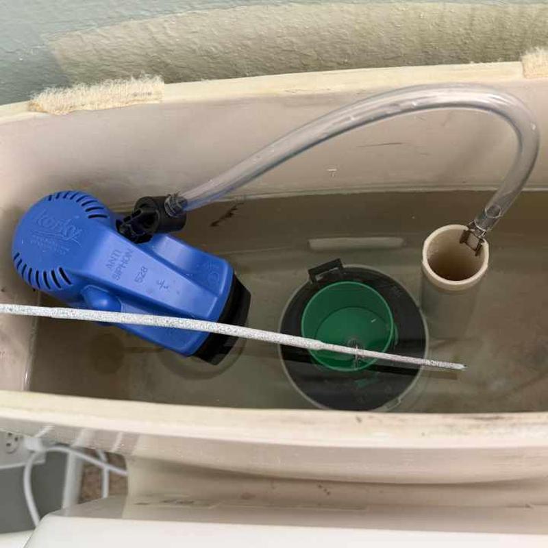 Toilet fill valve inside tank with replacement tubing