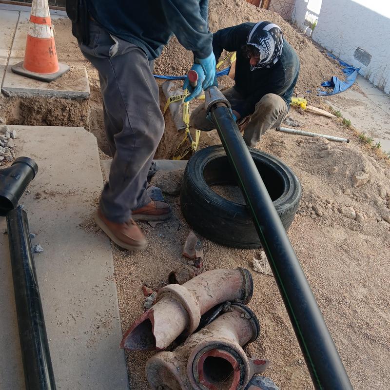 High density polyethylene sewer pipe replacement with workers