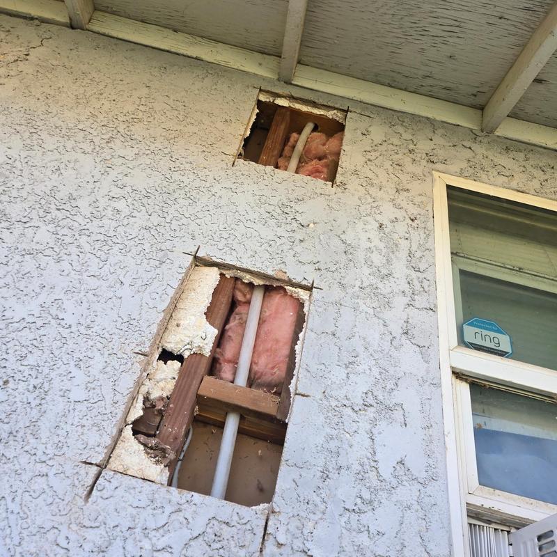 Hot water pipe reroute in exterior wall cavity