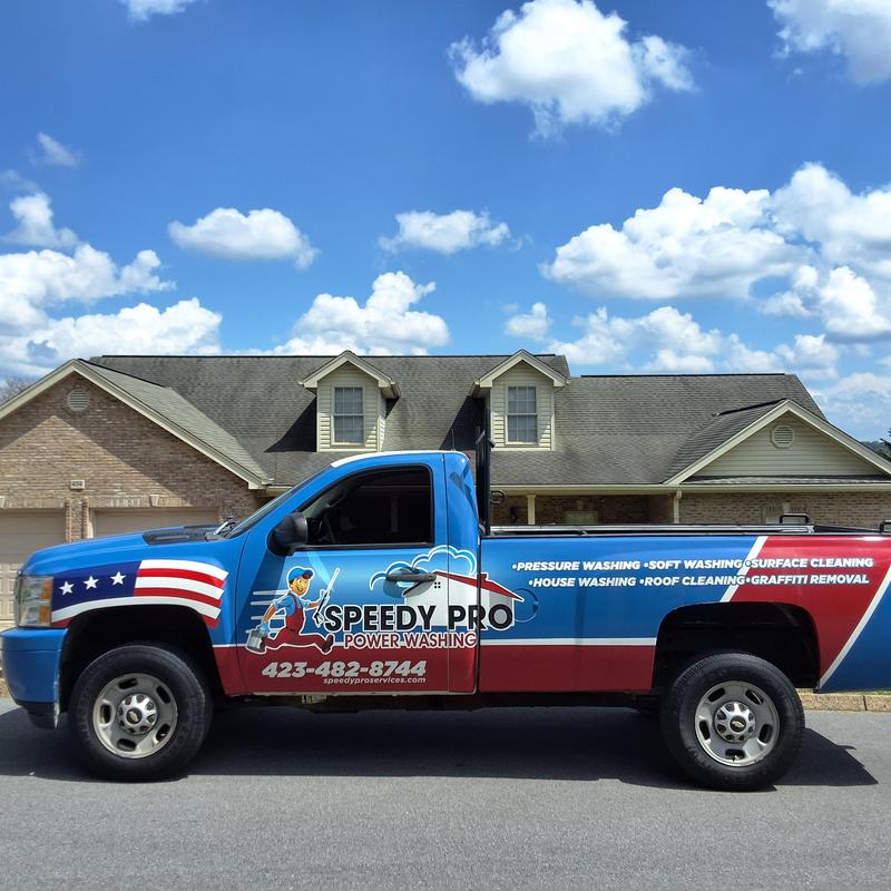 Power washing truck with service details on the side Power washing truck with service details on the side