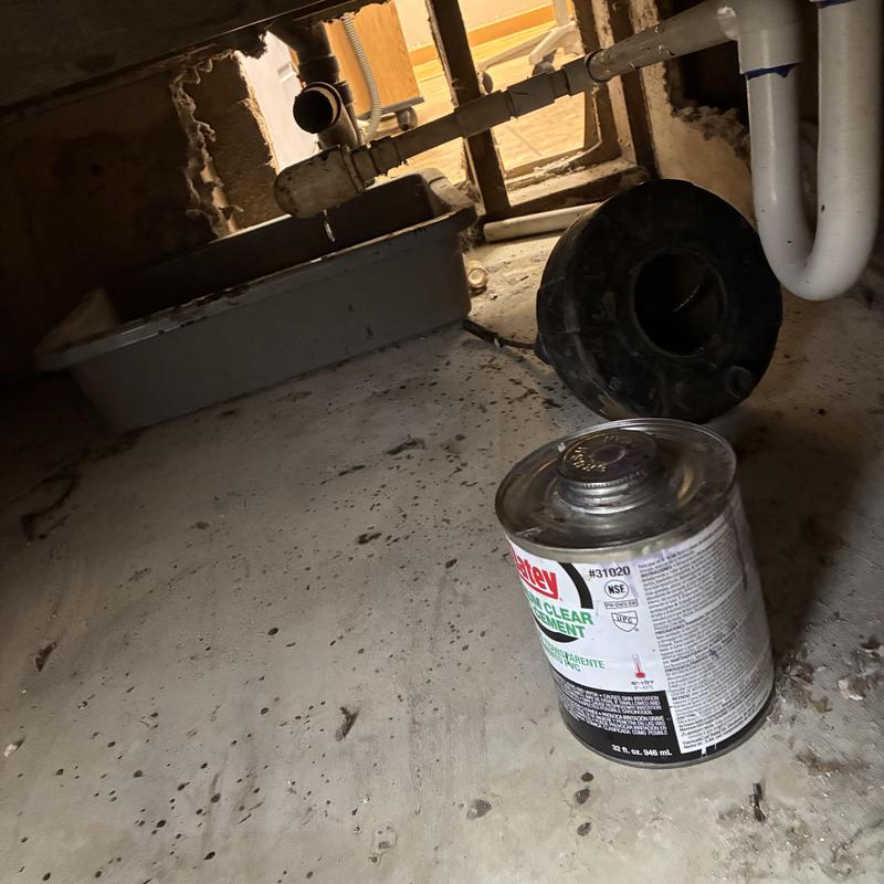 Drain pipe with cement can and removed trap under sink