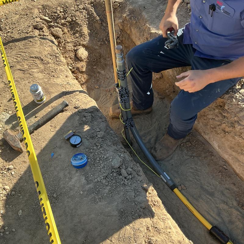 Gas line capped in trench with test fittings