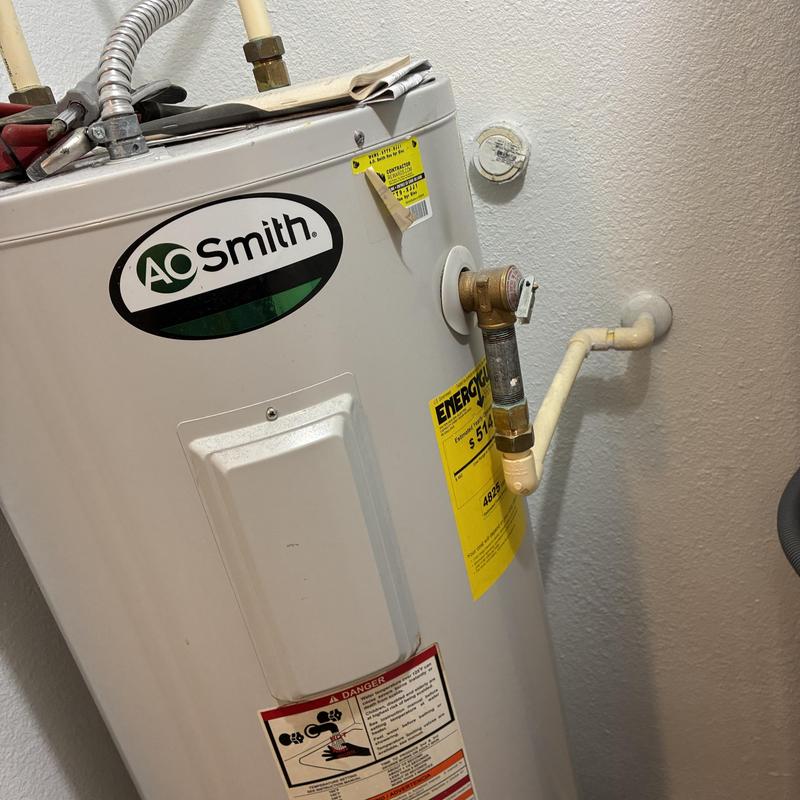 Water heater with gas line connection and valve adjustments
