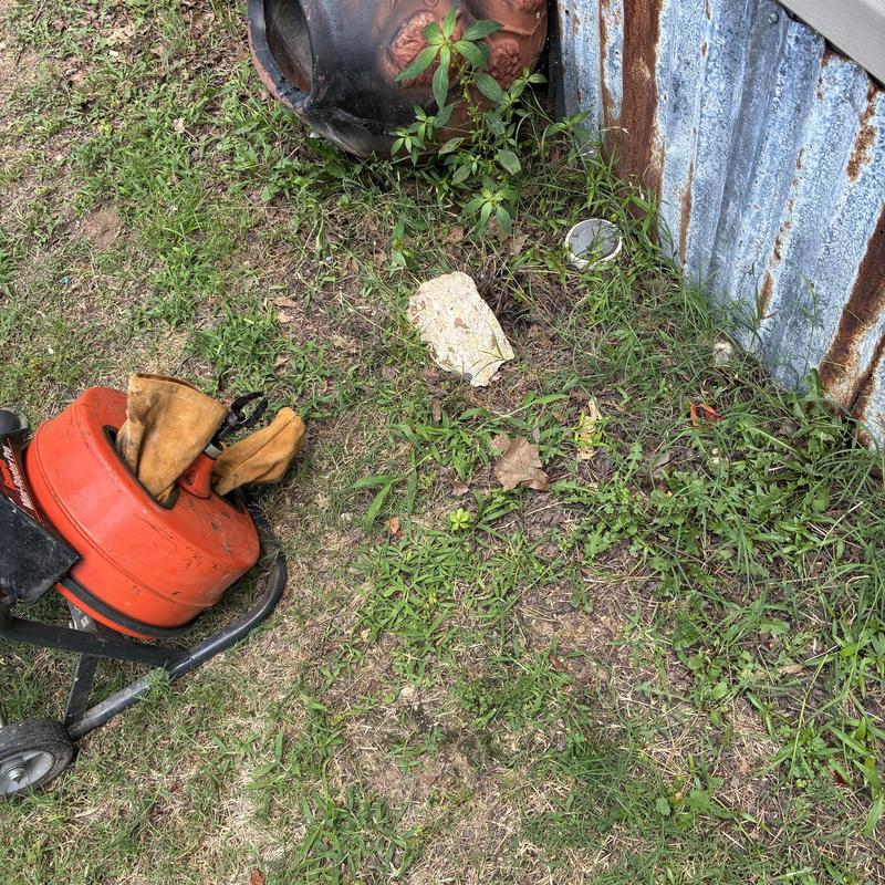 Front cleanout sewer line with plumbing tools outside