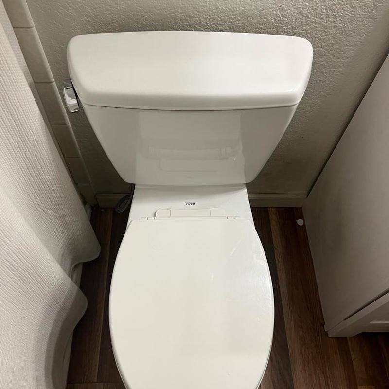 Toilet fill valve replacement and adjustment in bathroom
