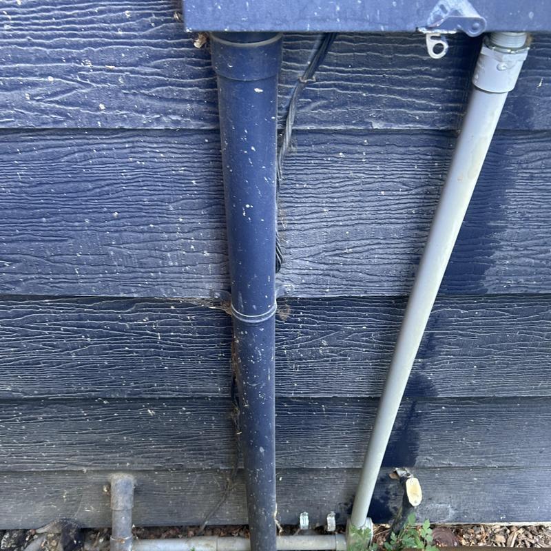 Electrical main breaker panel conduit outside home in Boise