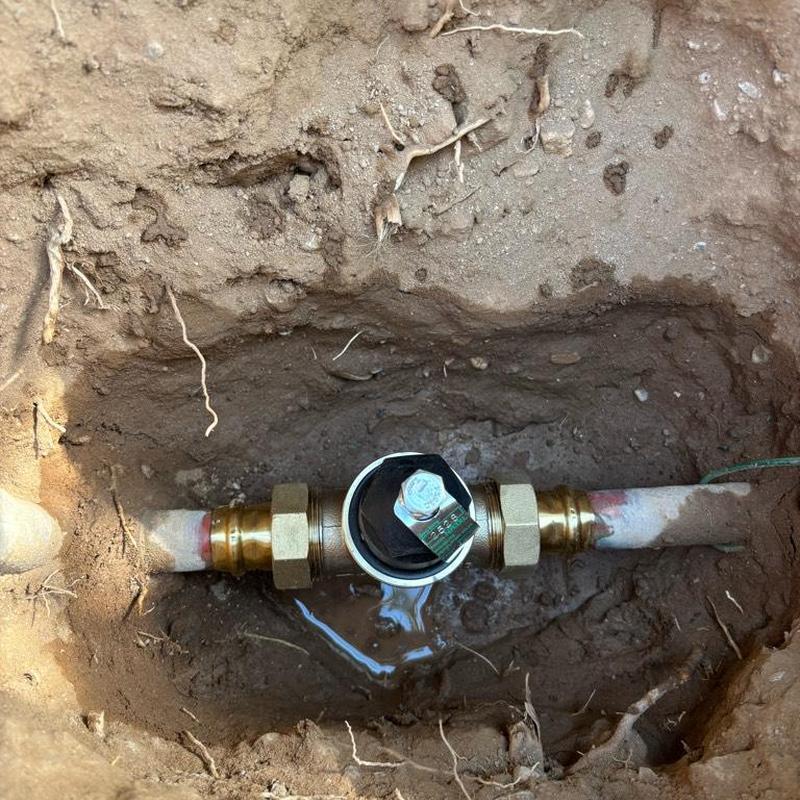 Pressure relief valve installation next to water meter
