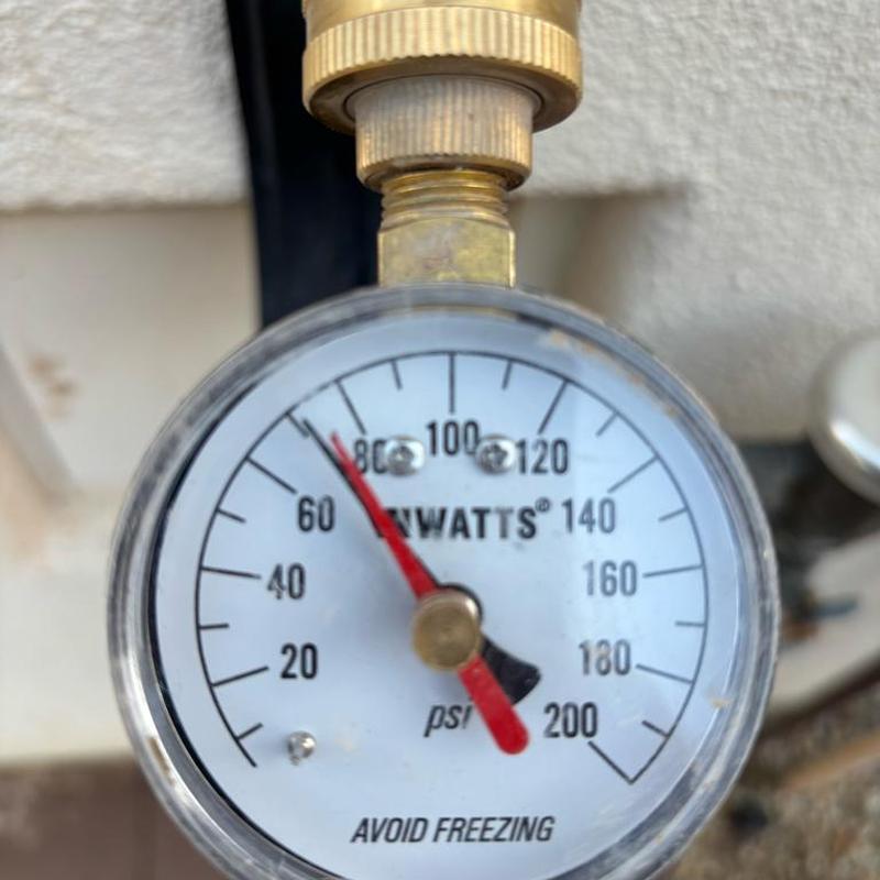 Pressure relief valve pressure gauge at 68 psi with brass fitting