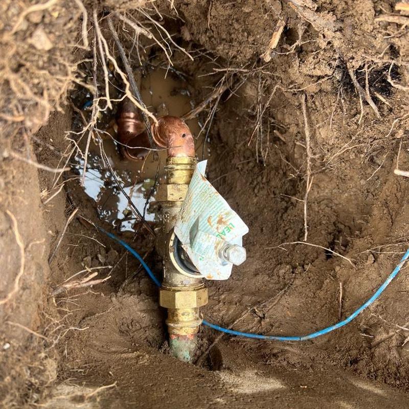 Water valve riser with 90-degree fittings in soil excavation