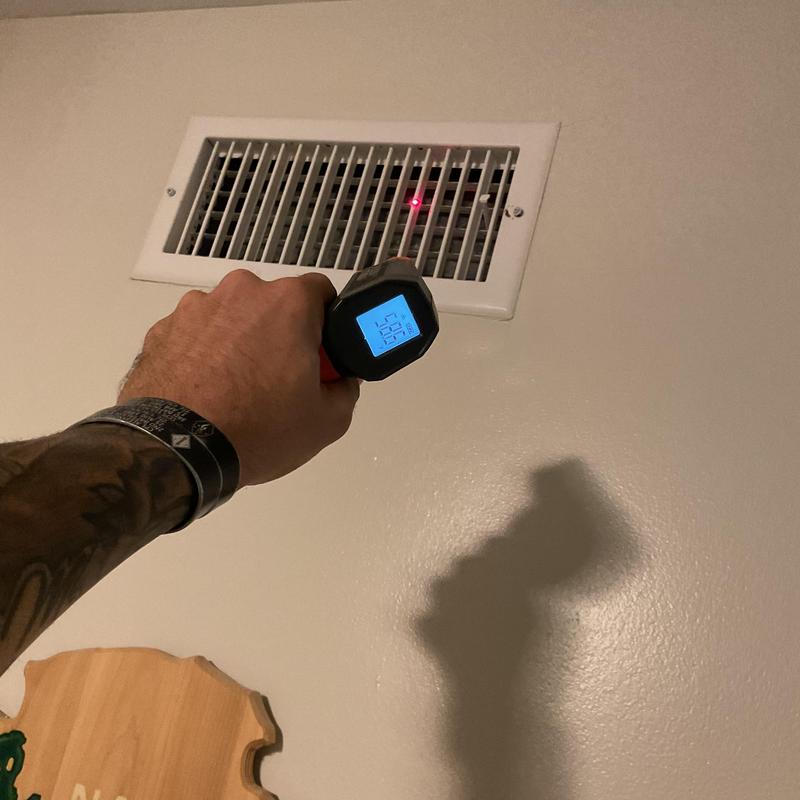 HVAC air vent temperature check with infrared thermometer HVAC air vent temperature check with infrared thermometer