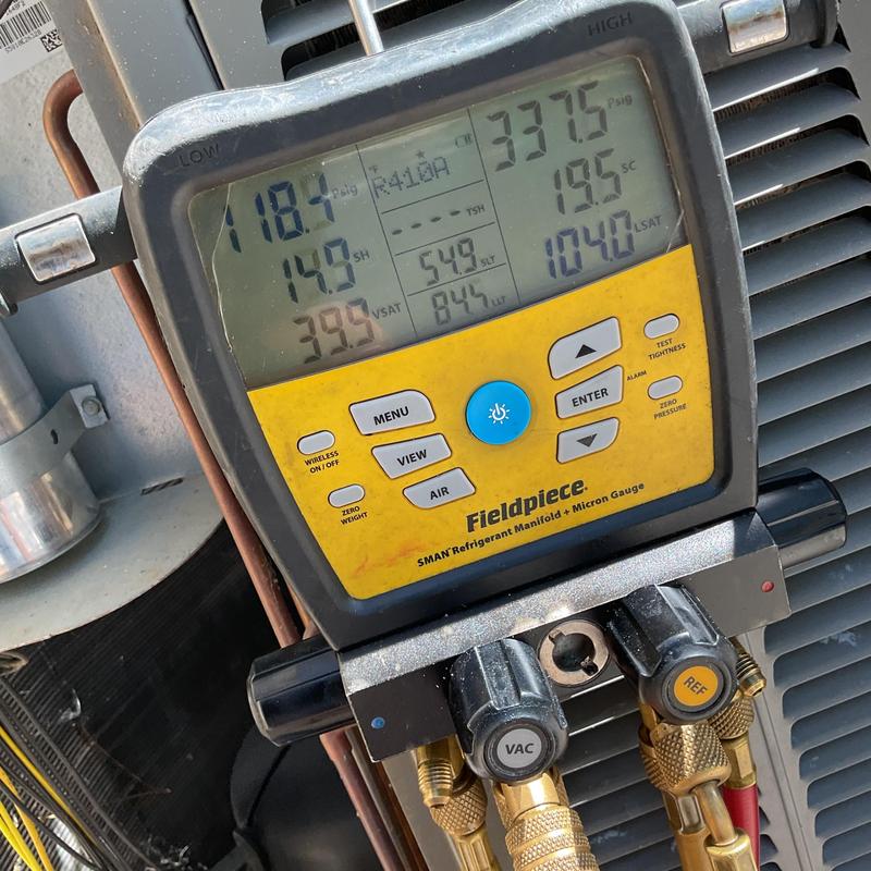 Refrigerant manifold gauge measuring AC system pressures Refrigerant manifold gauge measuring AC system pressures