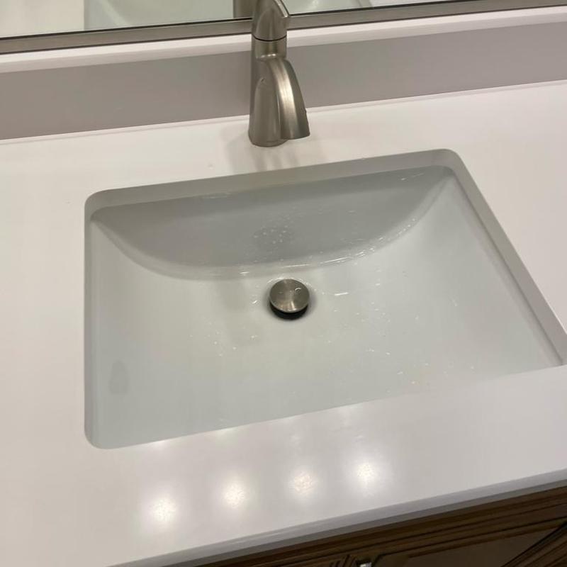 Under-mount bathroom sink with new pop-up drain installed
