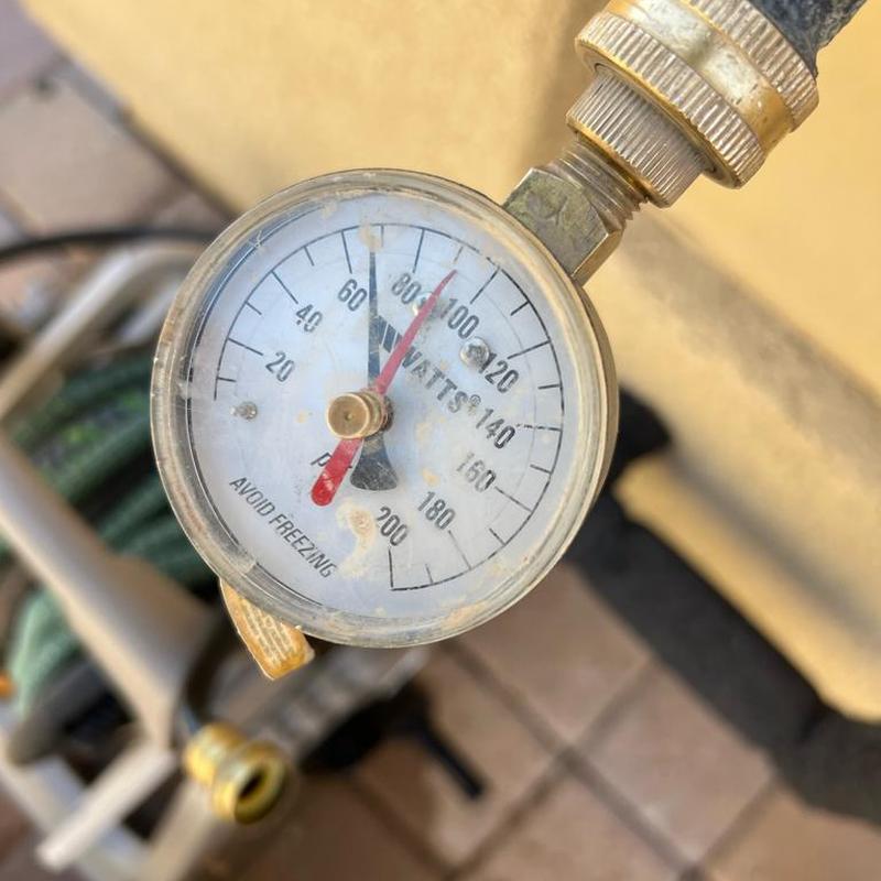 Water pressure gauge on outdoor hose bib